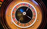 Roulette wheel table game at McLuck Casino with American and European variants for sweepstakes play